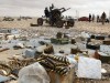 A rebel mans an anti-aircraft gun in Ras Lanuf